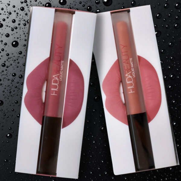"A model wearing Icon Liquid Matte Lipstick with bold eye makeup."