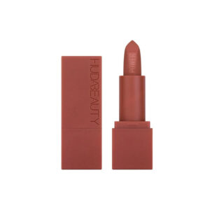 "Compact Huda Beauty Power Bullet Mini Lipstick displayed with its luxurious packaging."
