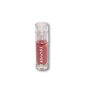 "Close-up of Tower 28 ShineOn Milky Lip Jelly in Pistachio Nude Pink with smooth, glossy finish"