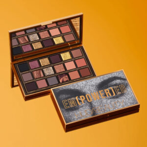 "Bold eye makeup created using HUDA BEAUTY Empowered Palette with gold and neutral tones."
