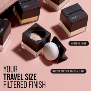 "Huda Beauty Mini Easy Bake Loose Powder in use for baking under-eye makeup."
