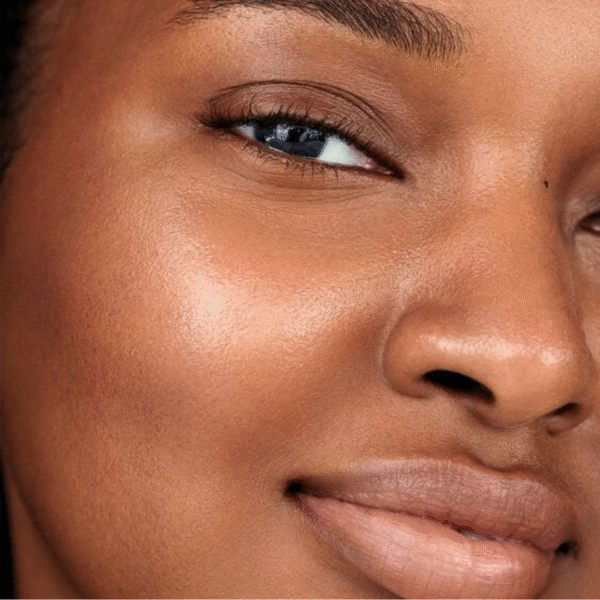 Fresh Lotus Youth Preserve Toner being poured onto a cotton pad before facial application