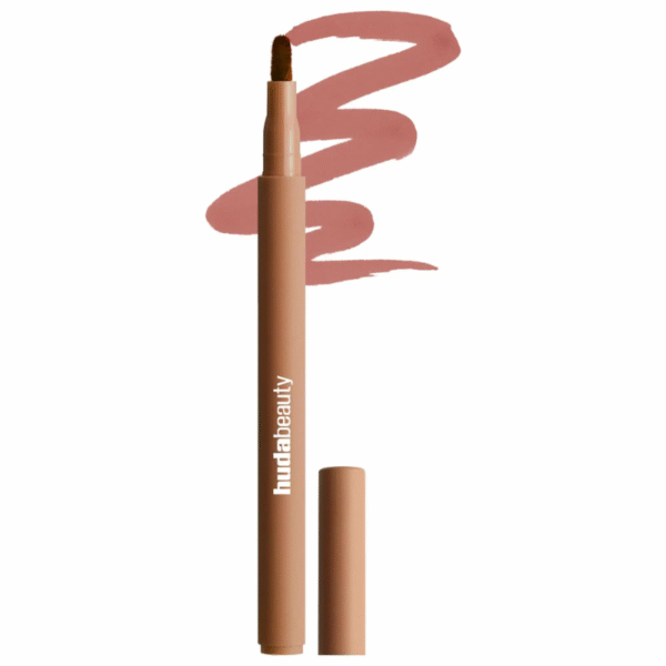 "Model wearing Huda Beauty Lip Contour Stain with bold matte finish"