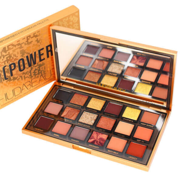 "Close-up of HUDA BEAUTY Empowered Palette shades, including mattes, metallics, and gel hybrids."